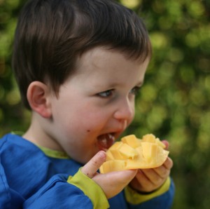 Jake eating mango 